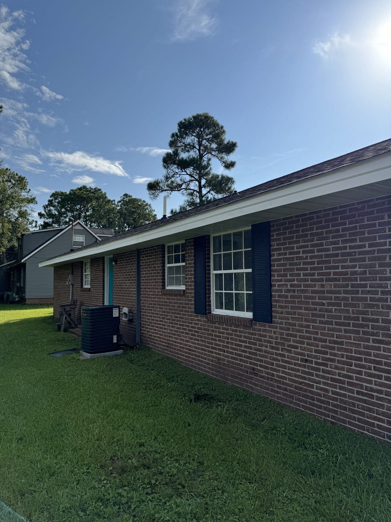 Brick Home Blue Shutters — TruShine Pressure Washing Conway