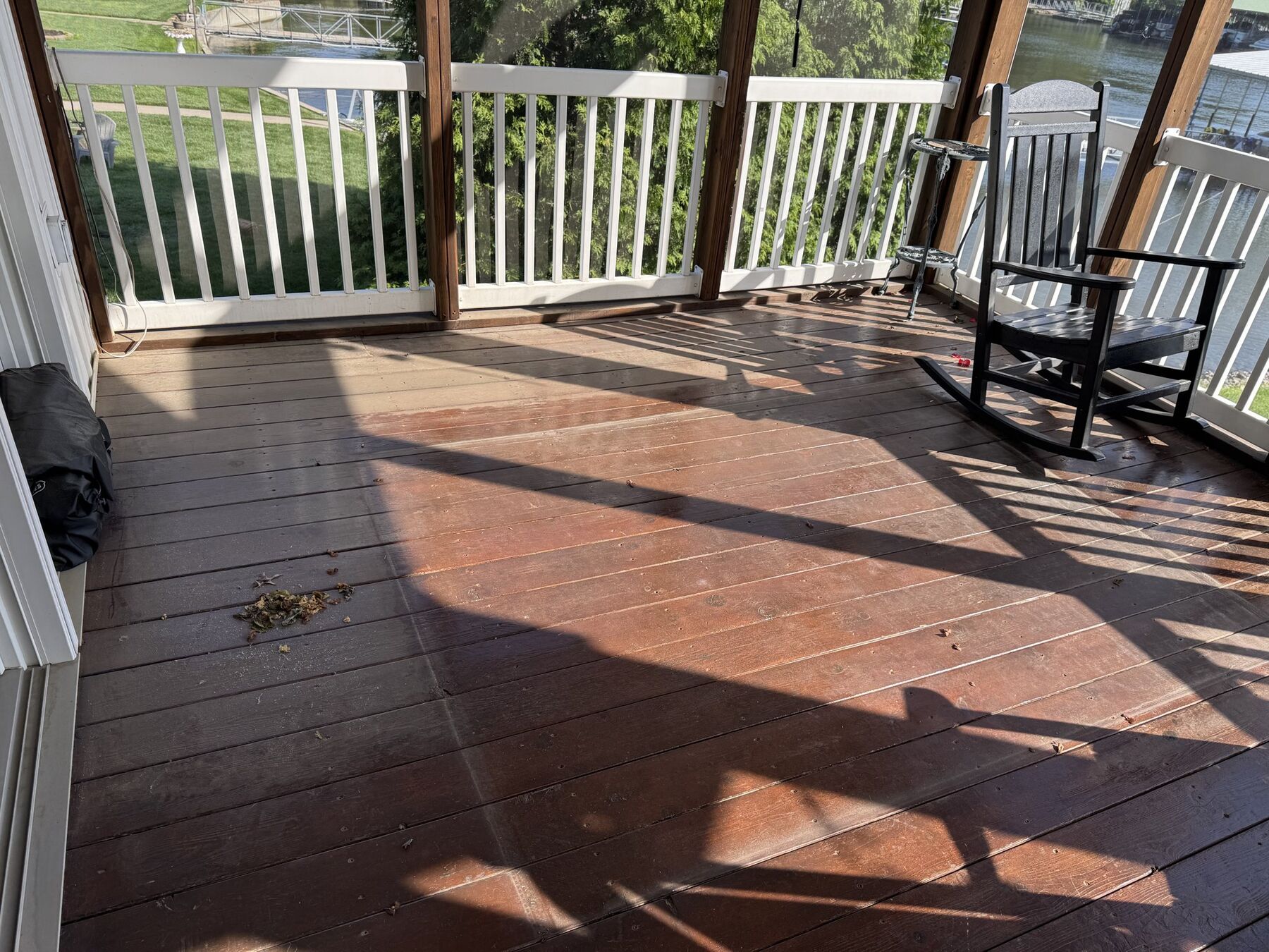 Freshly stained deck with rich brown finish — TruShine