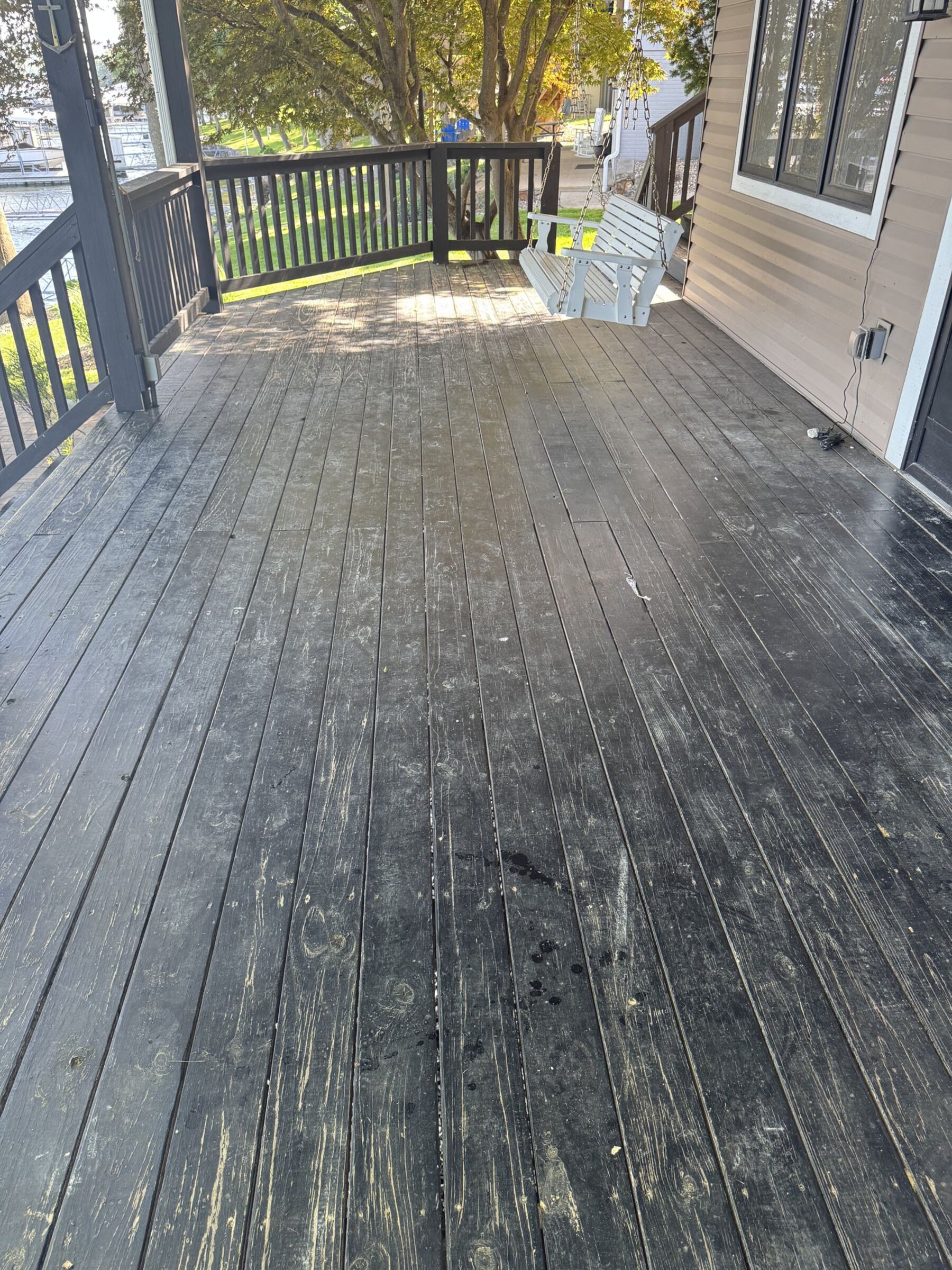 Weathered deck before staining — TruShine deck restoration