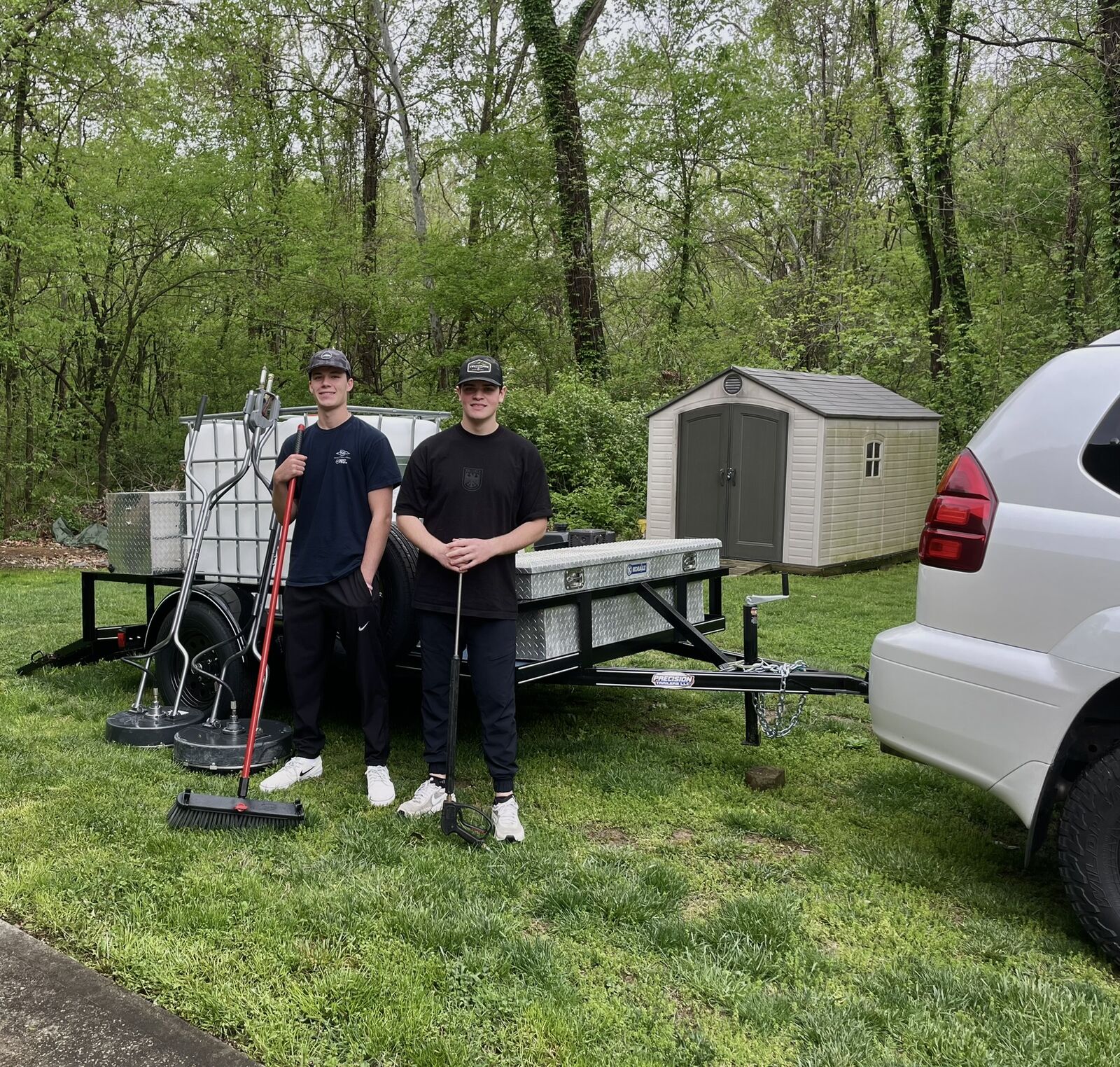 Ben and Carter, founders of TRUshine Pressure Washing, with their rig